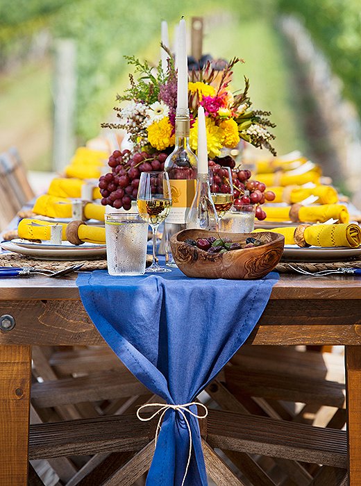 Tied with a length of twine, the linen table runner has an air of rustic elegance and easy charm.
