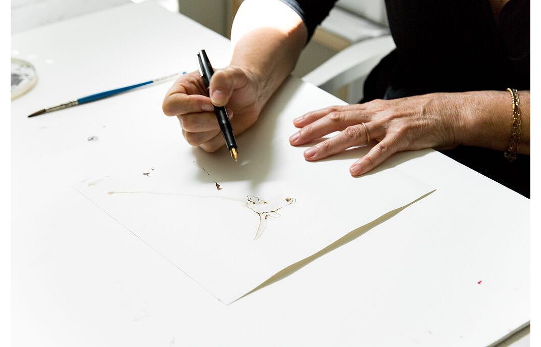 Mary at work on the finer details of a drawing.
