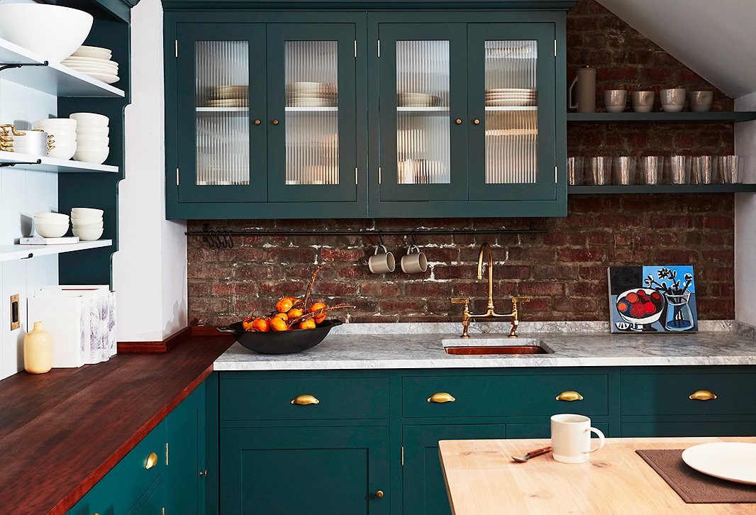 The kitchen at our Soho shop was custom-designed down to every last shelf and drawer pull. We chose a two-tone paint treatment and three countertop materials, which gives the kitchen the feeling of having been added to over time.
