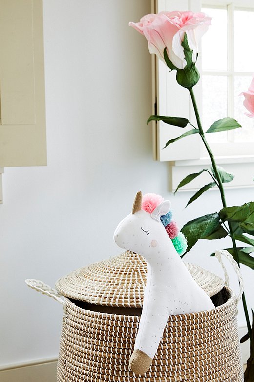 Lidded storage baskets can keep toys neatly contained (and their low height makes it easier for kids to help tidy up).
