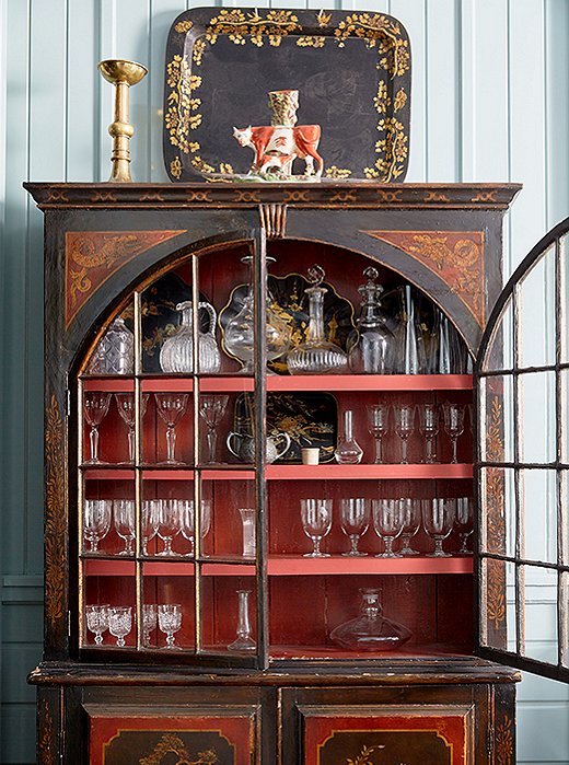 A chinoiserie bar cabinet in the dining room adds colorful contrast—and a well-traveled flair.
