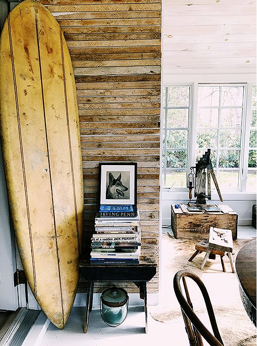 “I layer a lot by just resting artwork—placing objects on top of a stack of books or resting against a chair. I like to keep things loose and relaxed, because I’m always finding new things to add. It’s a beach cottage, so I don’t want it to feel or look too formal. Friends and guests should feel relaxed enough to walk around barefoot.”
