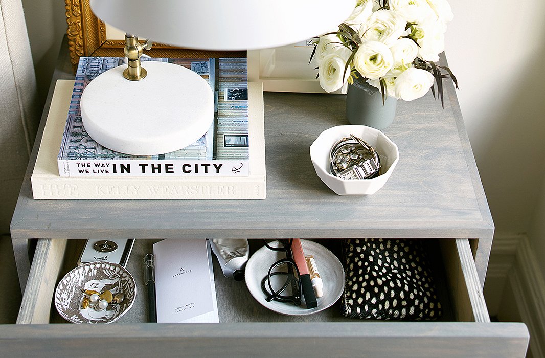 Inside the top drawer of Caitlin’s nightstand, mini bowls hold accessories and her glasses (critical to keep in arm’s reach for toddler wake-ups!). A clear lover of order, Caitlin adores taking off every piece of jewelry, putting it in its place, and closing the drawer.
