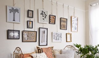 hanging paintings on wall