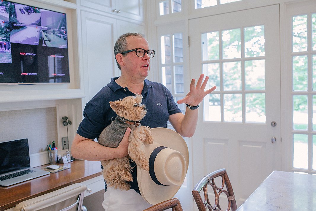 Alex and his Yorkie, Teddy, show guests around.
