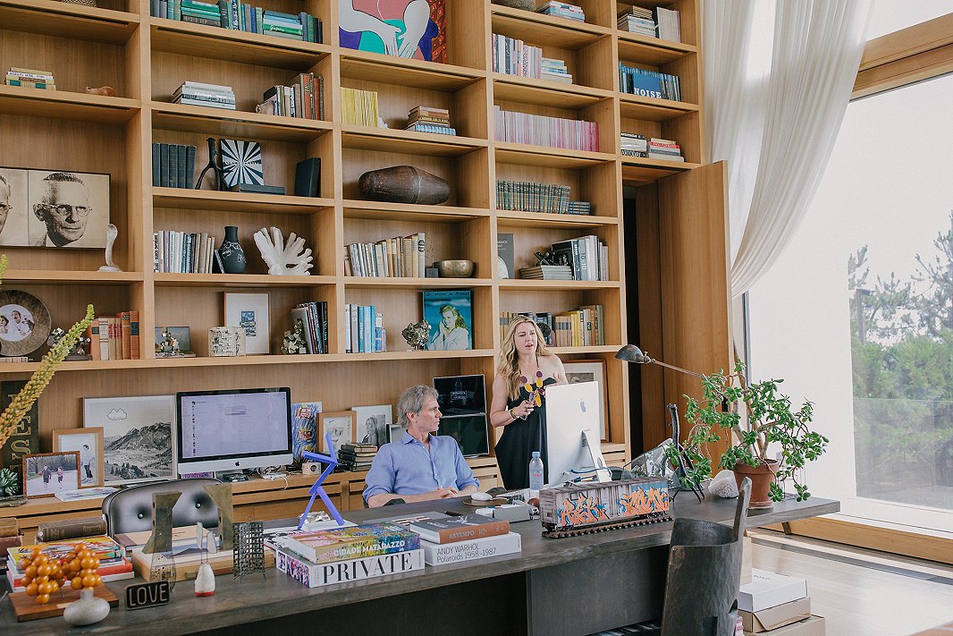 Kelly and her husband, investor Jay Sugarman, in the latter’s home office, which boasts both floor-to-ceiling built-ins and views of the Atlantic Ocean.
