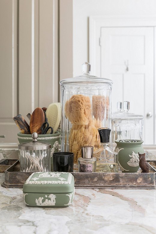 A collection of Wedgwood makes for an elegant countertop display in the master bath.
