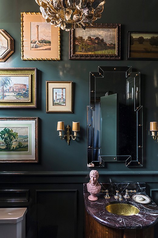In the powder room, Chad went against conventional wisdom by choosing a deep teal wall color. “I really love using dark, rich colors for small spaces that don’t get much light,” he says. “For me, it instantly glamorizes and anchors the room.”
