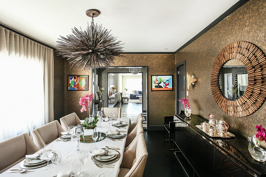 “The dining room keeps evolving,” says Natalie, who regularly participates in designer show houses and has incorporated several pieces from those projects into this space. She picked up the pair of colorful artworks on a trip to Rome.
