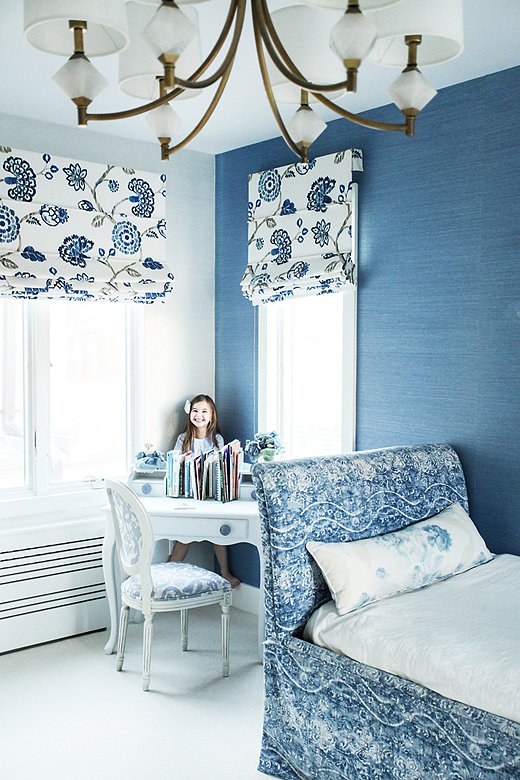 The petite desk was a lucky curbside find; repainted white with updated hardware, it’s the perfect piece for this bedroom corner. Natalie chose a durable indoor-outdoor fabric by Ralph Lauren for the trundle bed but used it on the reverse for a vintage feel.
