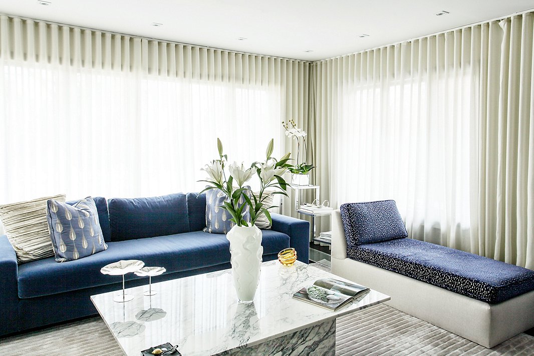 “I tend to be monochromatic but with lots of texture and contrast,” says Natalie of her go-to design approach, which comes through in the living room’s spectrum of blue and gray tones and touchable textures.
