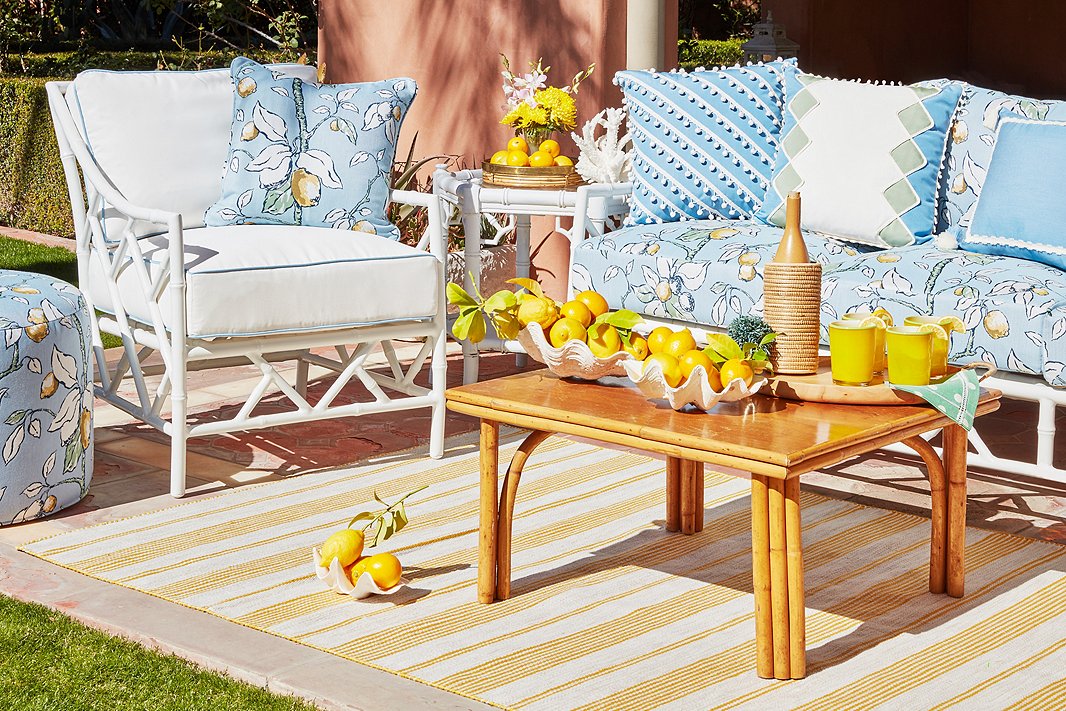 The Kit Sofa, Kit Lounge Chair, and Kit Round Pouf, all by Celerie Kemble for One Kings Lane, make up a chic and inviting outdoor seating area. The cheery lemon print is a dose of pure Palm Beach sunshine.
 
 

