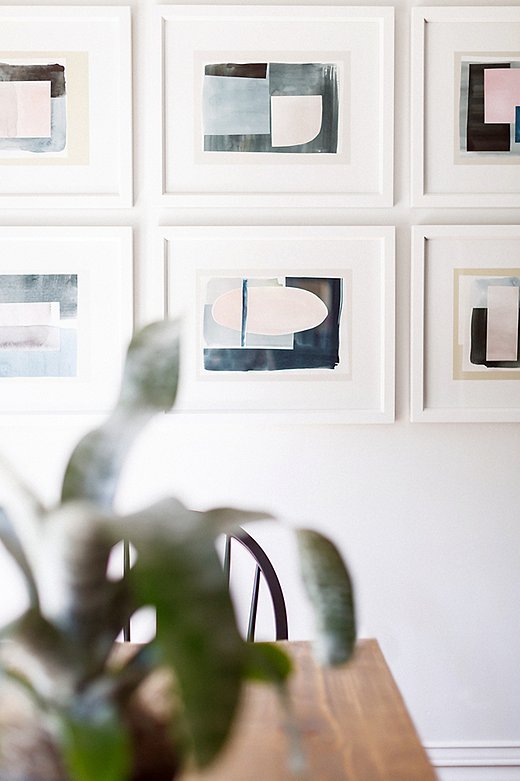 Hung in a neat grid, this set of nine abstract prints has the impact of a single large-scale work. “I love how the kitchen and breakfast area turned out,” says Elizabeth. “The space is bold yet calming at the same time.”
 
 
