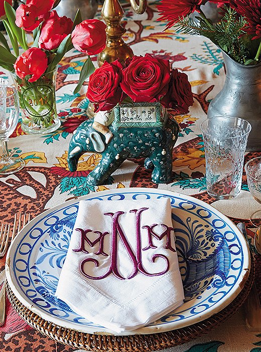 At her family’s home in Switzerland, Michelle sets a pattern-happy table with blue-and-white Spanish plates, monogrammed napkins, and a bold floral tablecloth.
