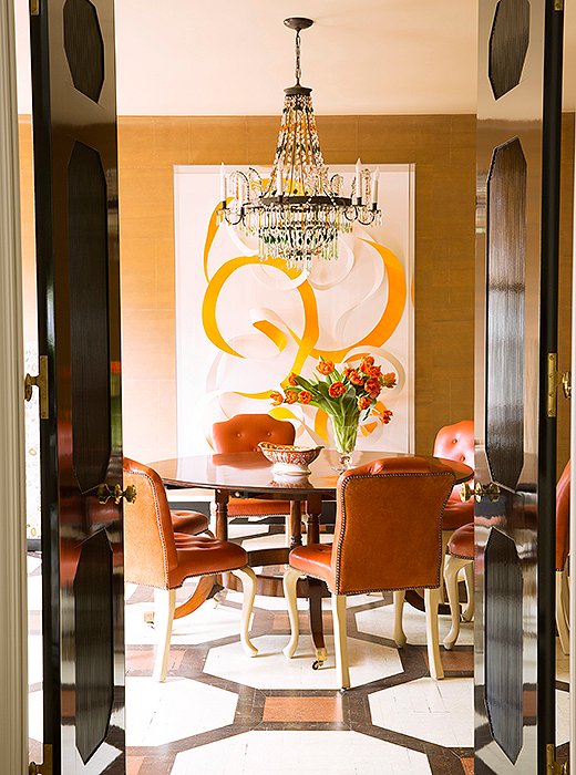 “Realistically, family dinner is a little hard for us,” says Kate, “because everyone’s lives are so busy, but we do try to have breakfast together four or five days a week at the dining room table.” Beneath a vintage Regency-style table by Jonathan Burden sits a 19th-century Austrian chandelier opposite artwork by Janaina Tschäpe.
