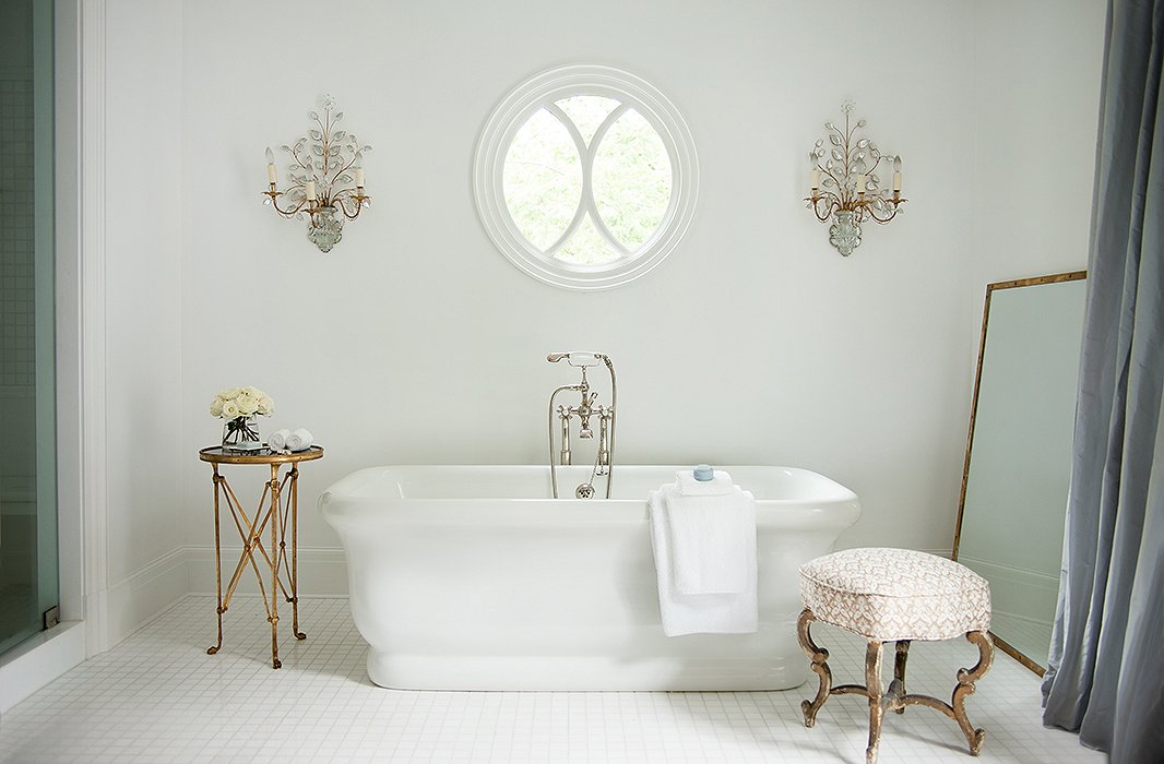 Beautiful vintage accents surround this master bath