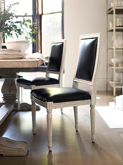 Upholstered in black leather, our Louis XVI-style Exeter chair takes on a modern edge. Photo by Michelle Drewes.
