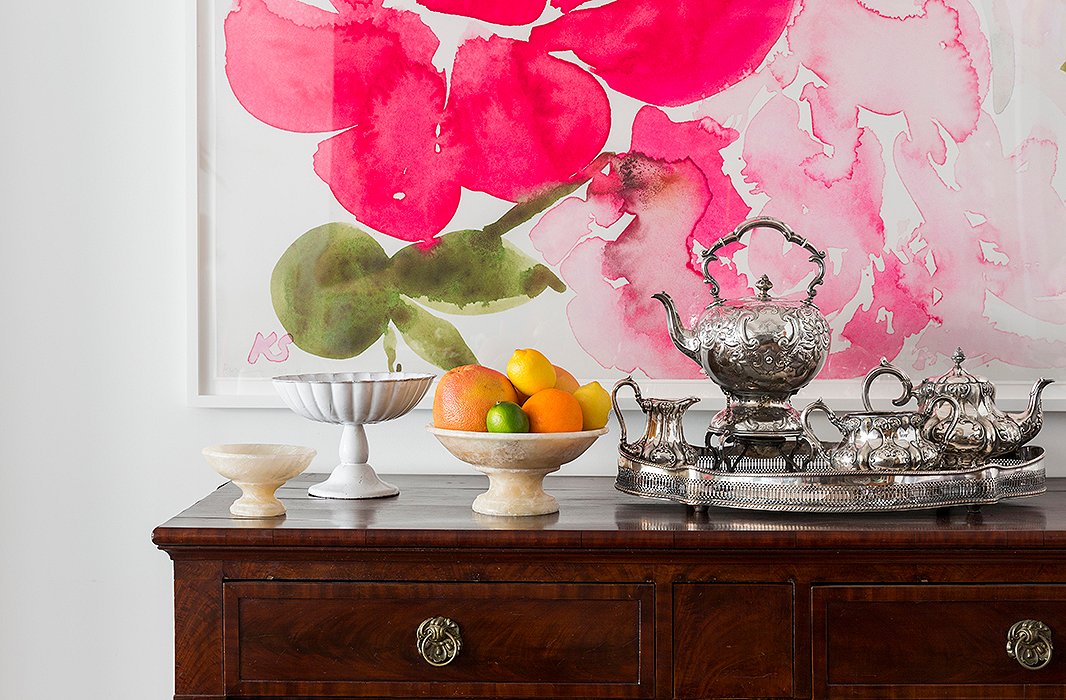 A silver tea set passed down from Kate’s great-grandmother maintains a place of prominence in the dining room. “My mom thought it was too fancy to have in the house growing up, so it just lived in one of those felt bags in a closet,” she says, “but I thought it was just too beautiful to keep hidden.”
