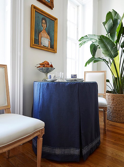 Against the wall, Amy’s table seats two—but with a little rearranging there’s plenty of room for a four-person dinner party. She scored the blue-and-white china set at a local thrift shop.
