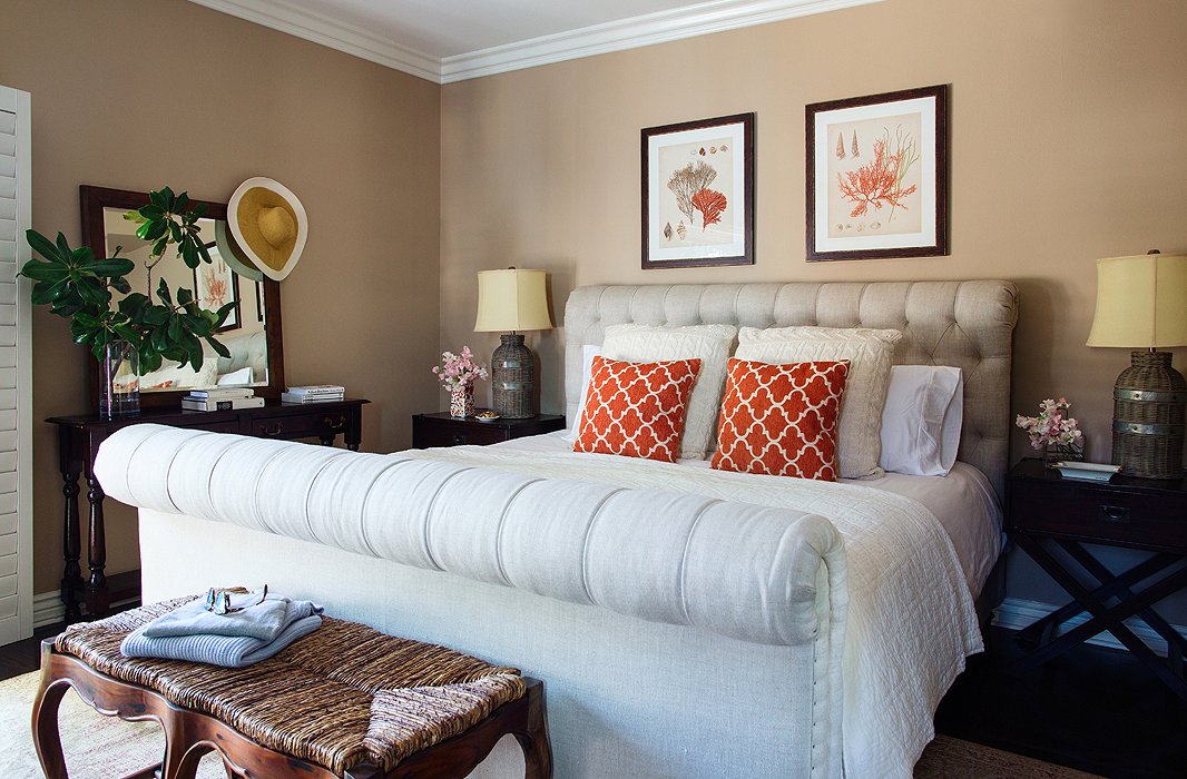 “I wanted a gigantic sleigh bed, and I think I got one,” laughs Louise, who went with moody taupe walls in the master bedroom for a rich, soothing vibe along with playful notes of coral. “I like to keep things neutral and then just add a little punch of color here and there.”
