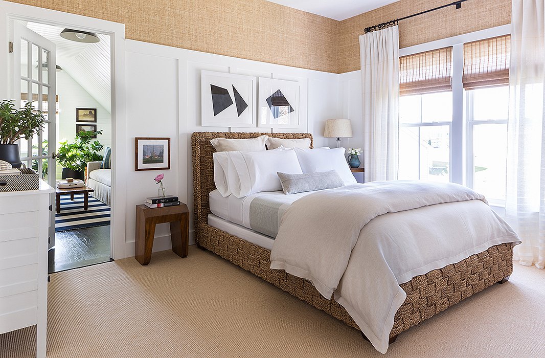 In the master bedroom, woven textures take center stage, from the Merida carpet and the Ralph Lauren wall covering to the luxurious woven bed (“How can I not be happy about that?”), while black-and-white paintings by Matthew are displayed just above. “I really wanted a shot of black. That’s something that wasn’t anywhere else in the home,” he says.
