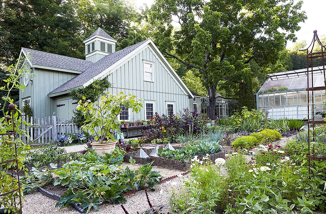 A board-and-batten barn, taking after 19th-century carriage houses, overlooks the vegetable and cutting gardens where “no two summers are quite alike” and snapdragons and zinnias, rosemary and thyme, and loads of dahlias overflow each year.
