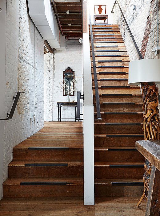 On the first level, the floors, ceiling trusses, and main staircase are made from wood salvaged from a former South African embassy built around the same pre-Civil War period as the building that houses Darryl’s boutique.
