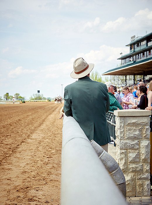 A man surveys the crowd just before the first race.
