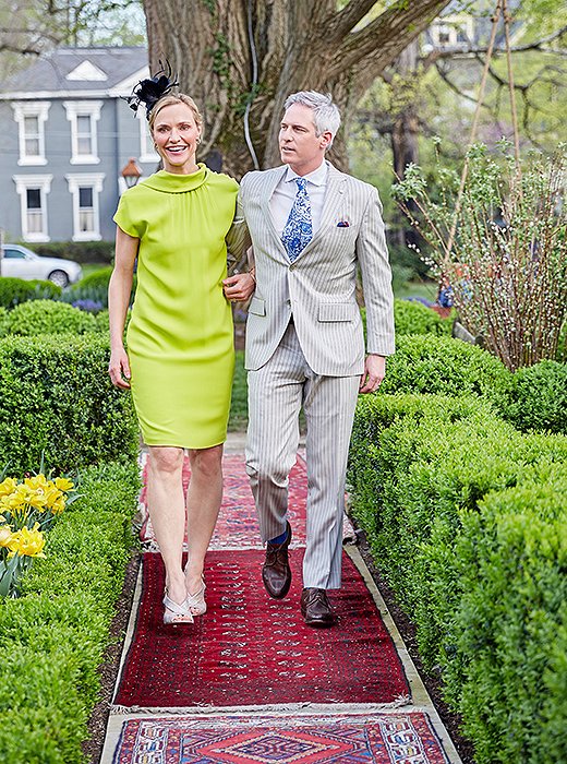 Two well-dressed guests make an entrance.
