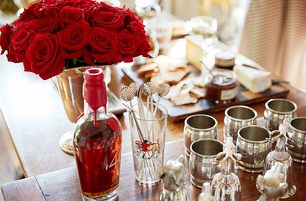 Silver straws and vintage glassware, at the ready for one of Jon’s famous takes on the old-fashioned, also elevate the party scene.
