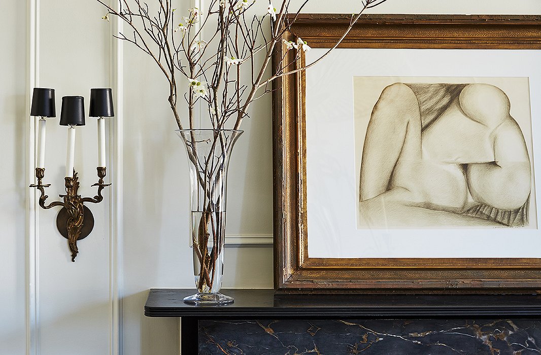 An abstract is placed above one of the home’s many mantels. “Some of my art is precious, some of it found,” Darryl says, “but each is very evocative to me on a very personal note. Some of the pieces serve almost as a Rorschach test in regards to my guests.”
