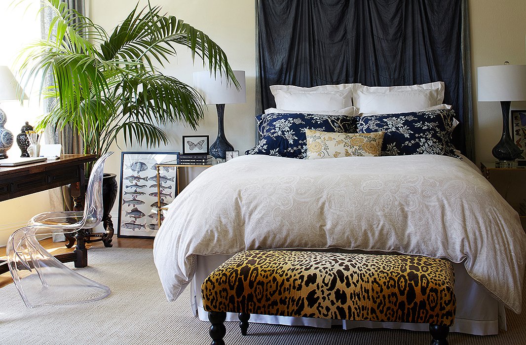 The leopard-print bench at the foot of Stacie’s bed acts as a daily place to put on shoes and can moonlight as dining room seating when she’s entertaining.
