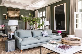 Designer Mark Cunningham created two distinct zones in this Connecticut home by placing sofas back-to-back to define separate sitting areas. Photo by Lesley Unruh. 
