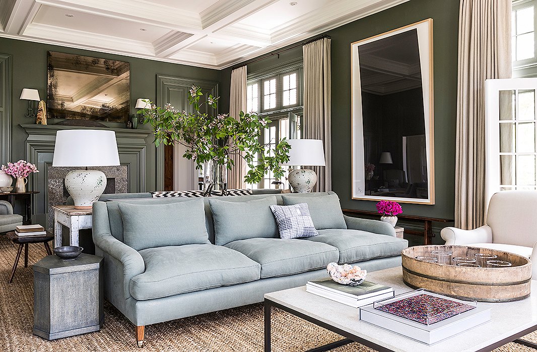 Brett tells us her expansive living room—which boasts dueling sofas—is her favorite: “The ceilings are high. There are windows and doors all around. I love every piece of furniture in it, and it’s just so comfortable.” The Brooke sofa is similar in style. Find a similar coffee table here.
