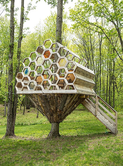 Brett worked with a local carpenter to construct her “bee house,” an elevated home for her bee hives. “He is amazingly artistic, actually,” she tells us, “so when we wanted to build the bee house, he was the one that was like, ‘Let’s do something a little bit unexpected.’”
