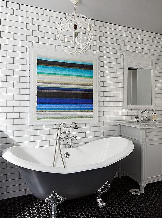 Above the bath: Don’t let a little tilework stop you from creating a museum-worthy focal point above the tub. 

