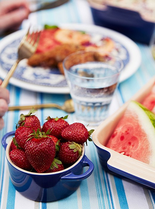 Bowls of strawberries and slices of watermelon made for easy and fresh summer desserts.
