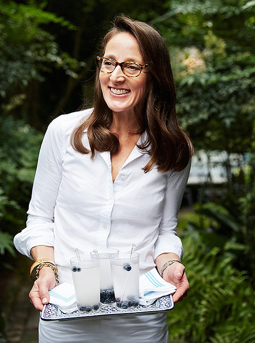 As a fun and inexpensive way to customize her linens, Guérard used Stitch Witchery bonding tape to iron grosgrain ribbon onto solid cocktail cotton napkins for a bordered effect.
