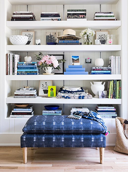 “The indigo bench that I have in front of my bookshelf is my favorite,” Michelle says of her collection of furniture. “I’m kind of obsessed with it. I love the clean lines of the pillow-top bench and also the fabric itself. It works anywhere.” She chose light-wood legs to give it “a more seaside and eclectic feel.”
