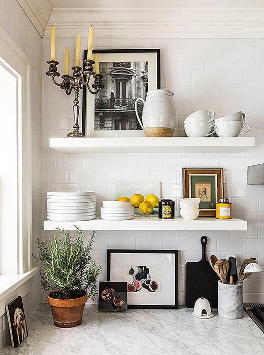 Open shelving creates an airy vibe and shows off Michelle’s clean white dinnerware and personal accessories.
