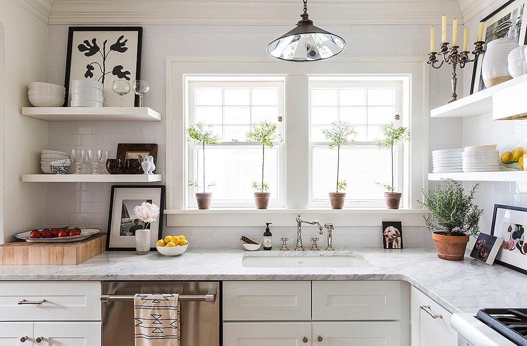 The kitchen and the master bath, which hadn’t been remodeled since the ’50s, were both gut-renovated. “I had a ball just working with Waterworks and finding really timeless materials like marble and subway tiles, and making everything clean and open and whitewashed,” Michelle says. “The renovation project was a blast for me.”
