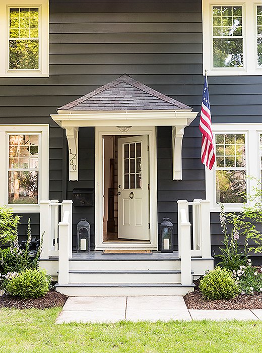 In order to mask the pediment above her front door, “which was really large in my opinion and really dark,” Michelle painted the whole house a dark charcoal color. “It works like a charm, if I do say so myself.”
