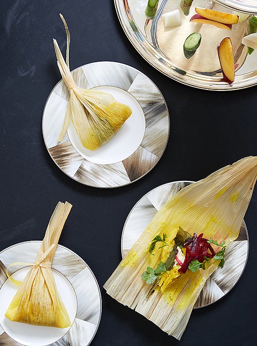 Freshly snipped cilantro makes a delicious garnish on horn-inspired plates by Ralph Lauren Home.
