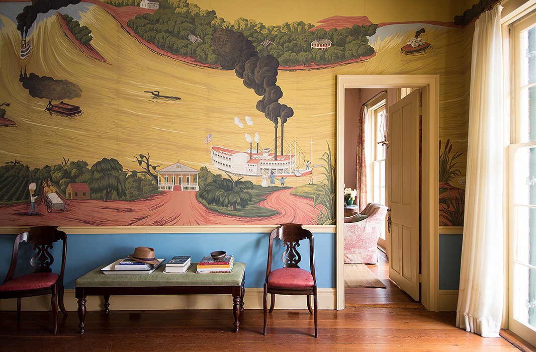 “Color is a good way to take a risk because if you fail, it’s easy to fix,” says Thomas, who chose a bright cobalt hue for the area underneath the parlor wall’s whimsical storybook-inspired mural. “It was fine without it, but we wanted to punch it up, and the blue made it more exciting.”
