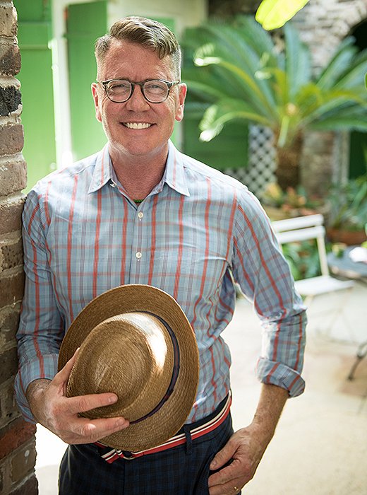 Designer Thomas Jayne in his home’s lush courtyard.
