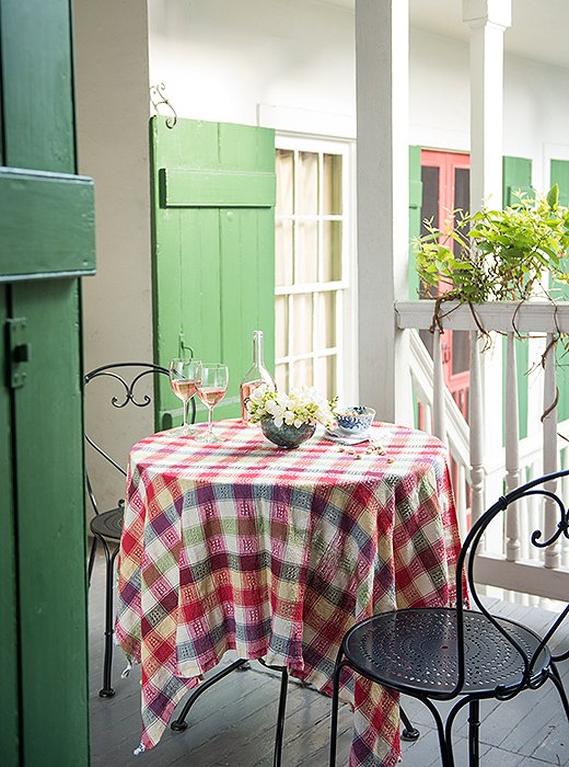 Thomas and husband Rick use the upstairs terrace frequently. “We can host a sit-down dinner or stand-up cocktail party here, or we’ll just sit and enjoy the outdoors.”
