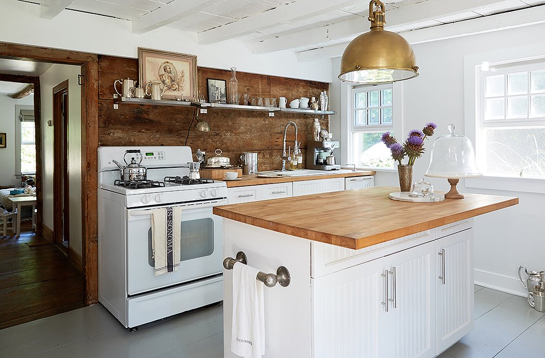 The Millers’ kitchen most recently had faux-granite countertops on maple cabinets. “We just resurfaced [the countertops] with cheap Ikea butcher block, painted the cabinets, and changed the hardware.”
