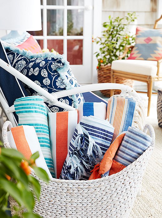 Estee keeps a collection of striped beach blankets handy for the pool and the beach.
