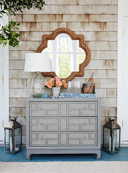 Estee decided to use a gray dresser as a bar to house her summer entertaining essentials. “All the drawers  are stocked for nights and parties,” she says.
