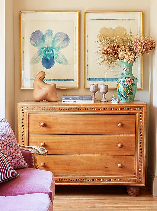 “I love the dresser with studs and the big ball feet,” Michelle gushes over the antique find. “It makes me want to buy plain dressers and put nail heads on them.”
